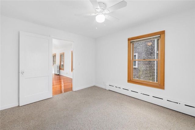 10 Curry Ave, Newport, RI 02840 - carpeted spare room featuring baseboard heating, a ceiling fan, radiator, and baseboards