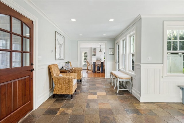 15 Rumstick Dr, Barrington, RI 02806 - foyer with stone tile flooring, a decorative wall, ornamental molding, a wainscoted wall, and recessed lighting