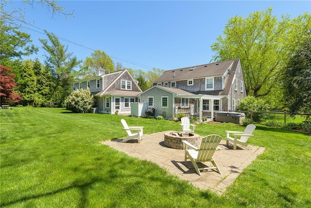 15 Rumstick Dr, Barrington, RI 02806 - rear view of property with a fire pit, a hot tub, a patio, and a chimney