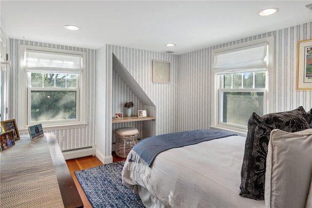 15 Rumstick Dr, Barrington, RI 02806 - bedroom with wallpapered walls, baseboard heating, wood finished floors, multiple windows, and recessed lighting