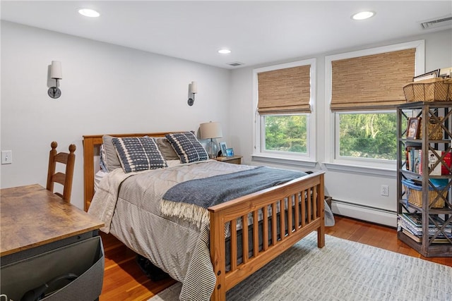 15 Rumstick Dr, Barrington, RI 02806 - bedroom featuring a baseboard heating unit, wood finished floors, and recessed lighting