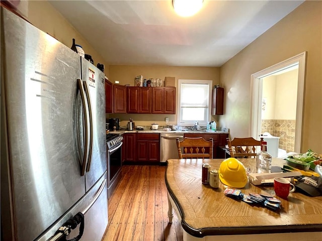 185 Williams St, Providence, RI 02906 - kitchen with appliances with stainless steel finishes, light countertops, and light wood-type flooring