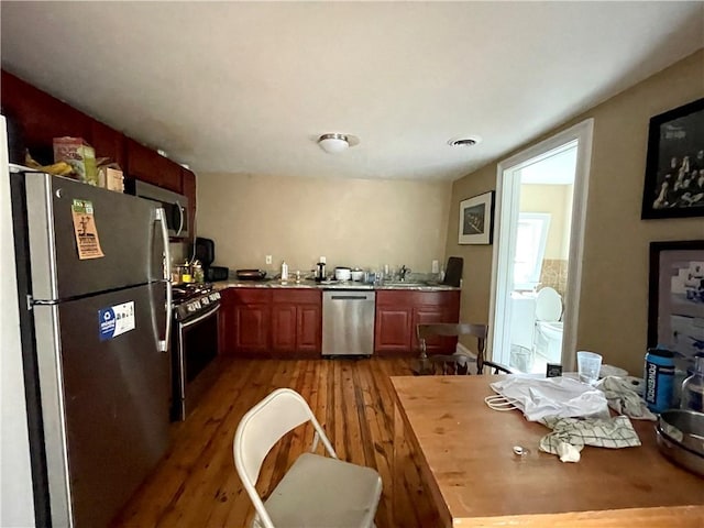 185 Williams St, Providence, RI 02906 - kitchen featuring stainless steel appliances, wood finished floors, and light countertops