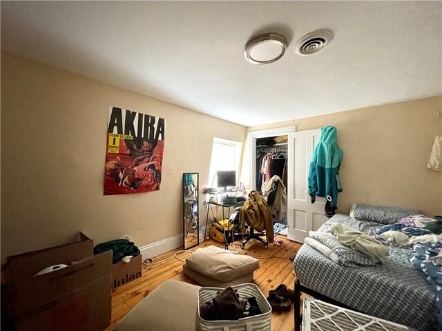 185 Williams St, Providence, RI 02906 - bedroom featuring wood finished floors, a closet, and baseboards