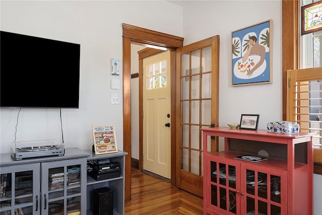 entryway with wood finished floors