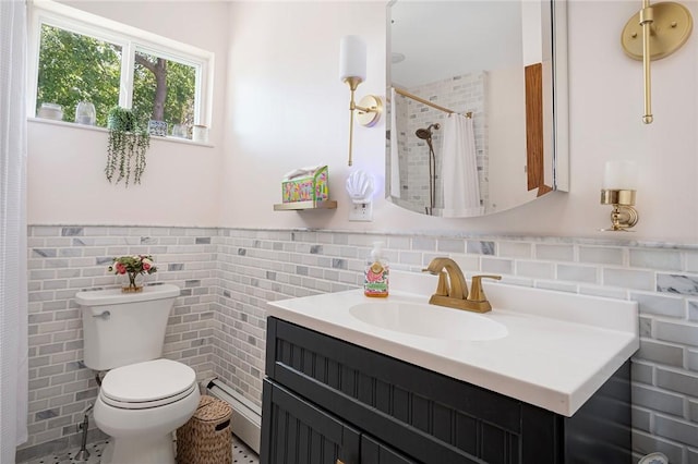 bathroom with tile walls, toilet, a wainscoted wall, vanity, and a shower with curtain