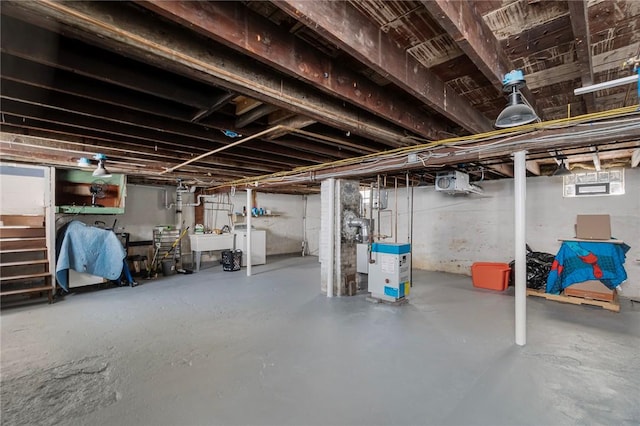 below grade area with a sink and washer and clothes dryer