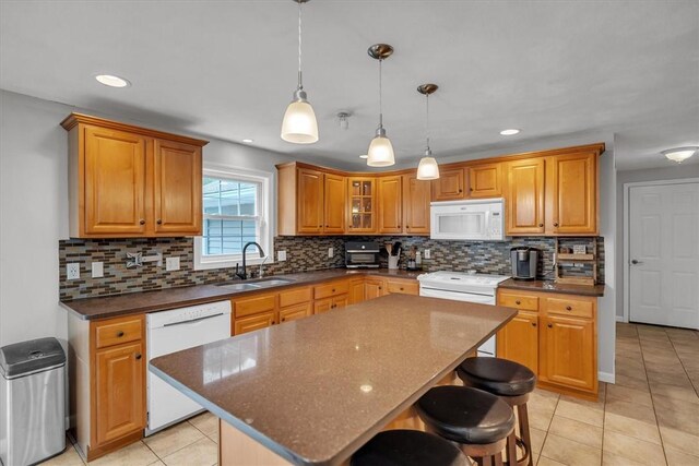 23 Blissdale Ave, Cumberland, RI 02864 - kitchen featuring white appliances, a sink, a breakfast bar, backsplash, and recessed lighting