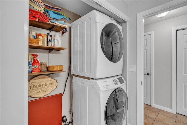 23 Blissdale Ave, Cumberland, RI 02864 - laundry area featuring estacked washer and dryer, light tile patterned floors, and baseboards
