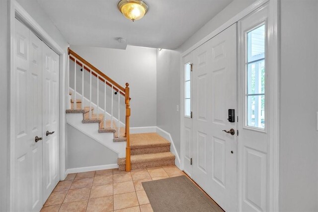 23 Blissdale Ave, Cumberland, RI 02864 - foyer featuring stairway, baseboards, and light tile patterned floors