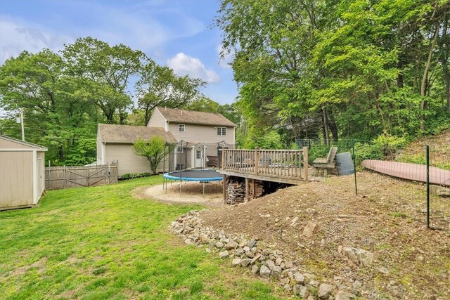 23 Blissdale Ave, Cumberland, RI 02864 - rear view of house featuring a trampoline and a deck