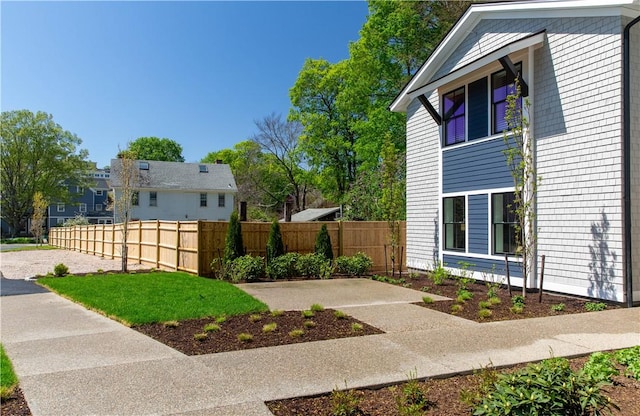 32 Exchange St Unit 101, East Greenwich, RI 02818 - view of home's exterior with fence
