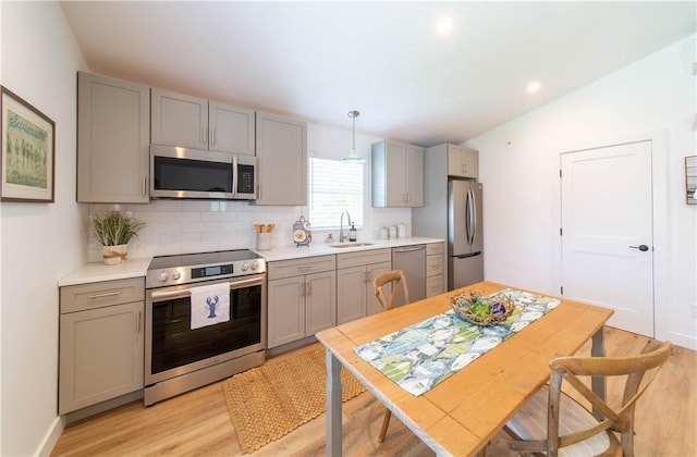 32 Exchange St Unit 101, East Greenwich, RI 02818 - kitchen with appliances with stainless steel finishes, gray cabinets, a sink, light wood-type flooring, and recessed lighting