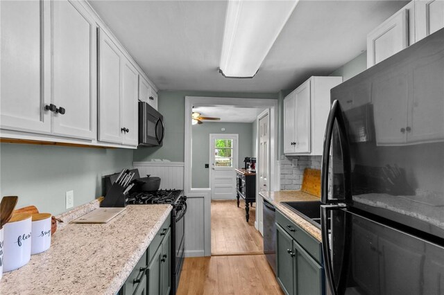 40 Glen St, East Providence, RI 02915 - kitchen featuring black appliances, light wood-type flooring, ceiling fan, white cabinetry, and backsplash