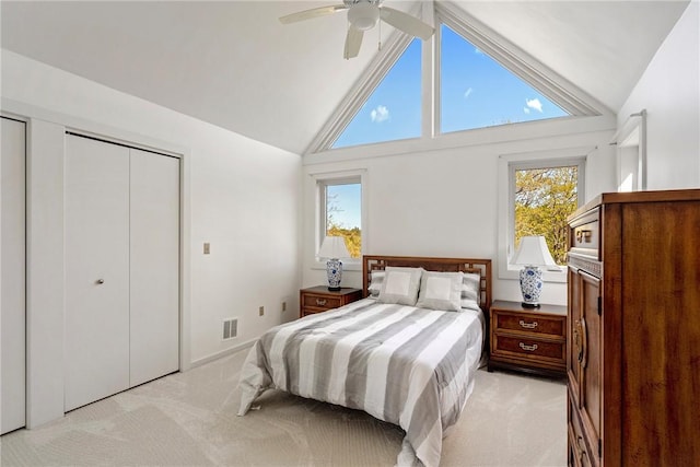15 Hammersmith Rd Unit 19, Newport, RI 02840 - bedroom with light colored carpet, multiple windows, high vaulted ceiling, and a ceiling fan