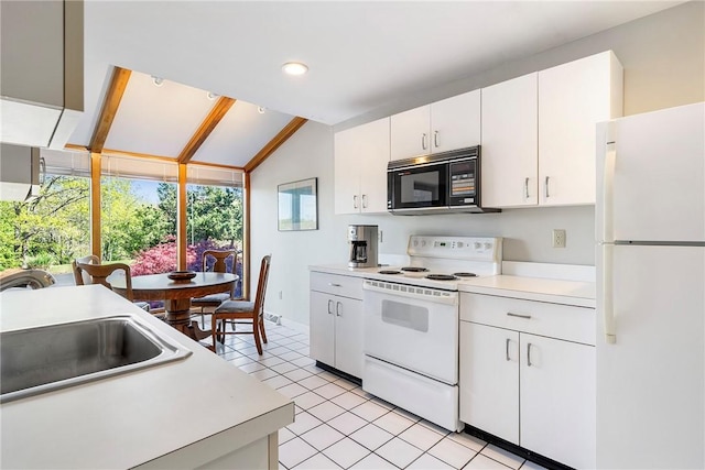 15 Hammersmith Rd Unit 19, Newport, RI 02840 - kitchen featuring white appliances, a sink, light countertops, white cabinetry, and vaulted ceiling