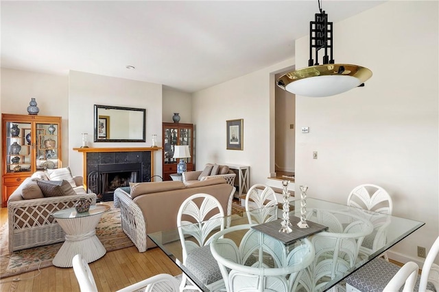 15 Hammersmith Rd Unit 19, Newport, RI 02840 - dining room with light wood-style flooring and a fireplace