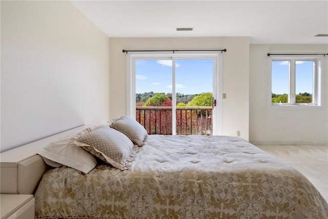 15 Hammersmith Rd Unit 19, Newport, RI 02840 - carpeted bedroom featuring multiple windows and access to outside