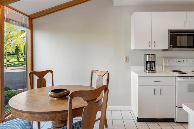 15 Hammersmith Rd Unit 19, Newport, RI 02840 - dining space with light tile patterned floors and baseboards