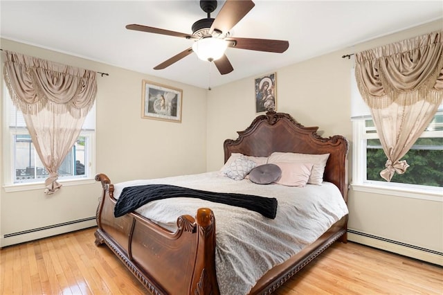 19 S Locust Ave, North Providence, RI 02911 - bedroom with a baseboard heating unit, hardwood / wood-style floors, and ceiling fan
