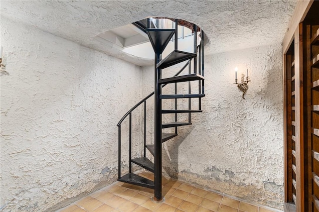 19 S Locust Ave, North Providence, RI 02911 - stairway with a textured wall and tile patterned flooring