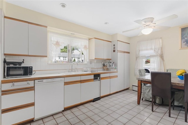 19 S Locust Ave, North Providence, RI 02911 - kitchen featuring dishwasher, a sink, black microwave, and plenty of natural light