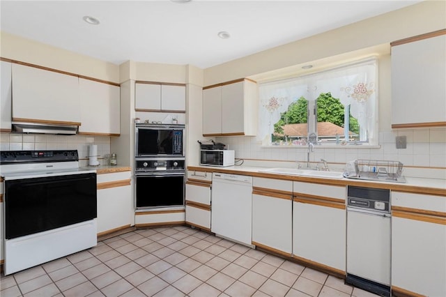 19 S Locust Ave, North Providence, RI 02911 - kitchen featuring white appliances, tasteful backsplash, light countertops, white cabinets, and a sink