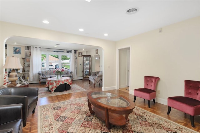 19 S Locust Ave, North Providence, RI 02911 - living area featuring arched walkways, recessed lighting, and baseboards