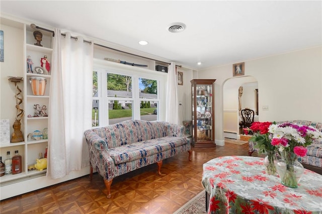 19 S Locust Ave, North Providence, RI 02911 - living room featuring arched walkways, a baseboard radiator, and recessed lighting