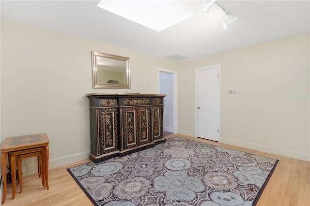 19 S Locust Ave, North Providence, RI 02911 - bedroom featuring light wood-style flooring, baseboards, and rail lighting