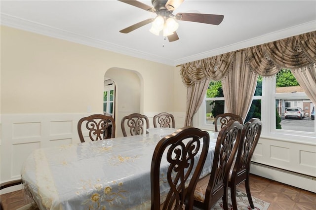 19 S Locust Ave, North Providence, RI 02911 - dining space with arched walkways, a decorative wall, crown molding, a ceiling fan, and a wainscoted wall