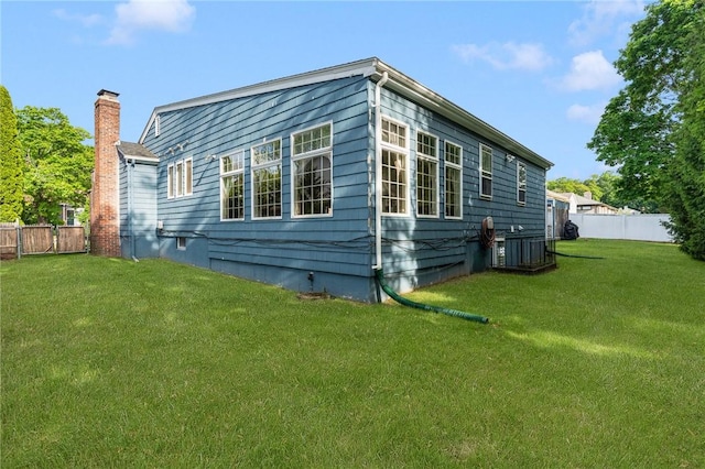19 S Locust Ave, North Providence, RI 02911 - view of side of property featuring a chimney and crawl space