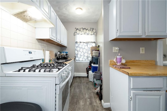 115 Division St, Pawtucket, RI 02860 - kitchen featuring white gas range oven, dark wood-type flooring, under cabinet range hood, light countertops, and white cabinets