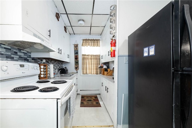 115 Division St, Pawtucket, RI 02860 - kitchen featuring freestanding refrigerator, white electric stove, a sink, a baseboard radiator, and white cabinets