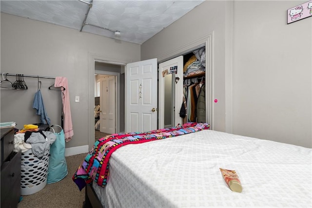 115 Division St, Pawtucket, RI 02860 - carpeted bedroom featuring a closet and baseboards