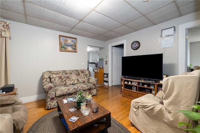 115 Division St, Pawtucket, RI 02860 - living room featuring wood finished floors, baseboards, and a drop ceiling