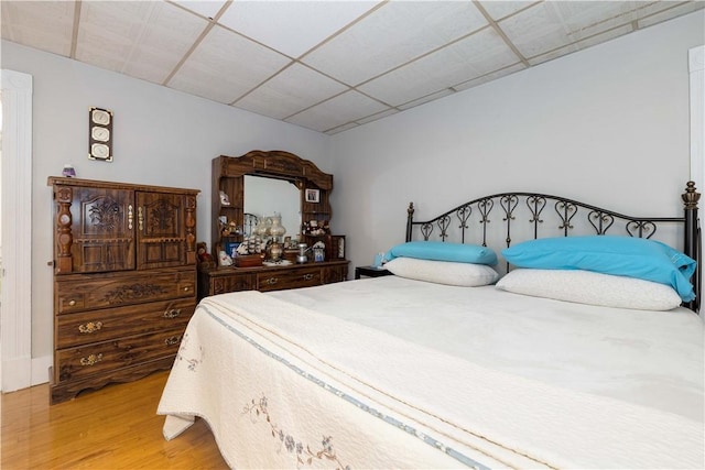 115 Division St, Pawtucket, RI 02860 - bedroom featuring wood finished floors and a paneled ceiling