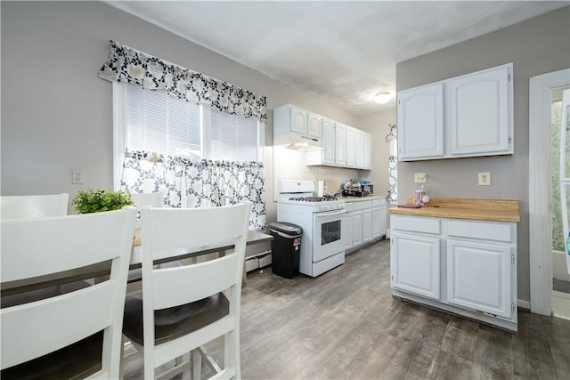 115 Division St, Pawtucket, RI 02860 - kitchen featuring white gas range oven, white cabinetry, wood finished floors, and light countertops