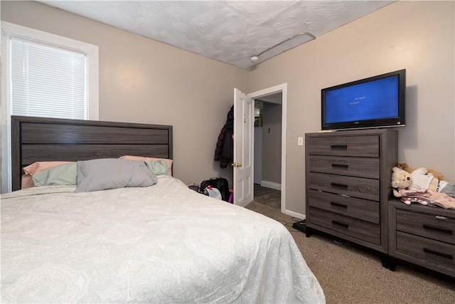 115 Division St, Pawtucket, RI 02860 - carpeted bedroom featuring baseboards