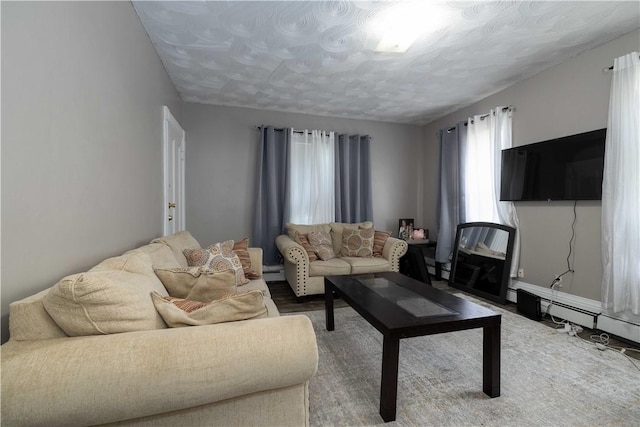 115 Division St, Pawtucket, RI 02860 - living room featuring a baseboard radiator