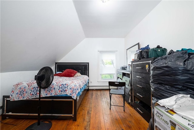 115 Division St, Pawtucket, RI 02860 - bedroom featuring lofted ceiling, wood-type flooring, and a baseboard heating unit