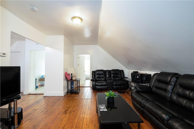 115 Division St, Pawtucket, RI 02860 - living room featuring wood-type flooring, lofted ceiling, and baseboards