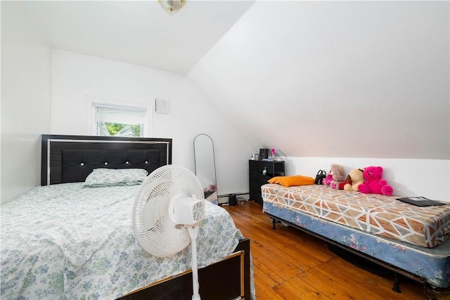 115 Division St, Pawtucket, RI 02860 - bedroom with lofted ceiling, hardwood / wood-style floors, and a baseboard heating unit