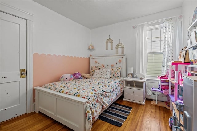 bedroom with wood-type flooring