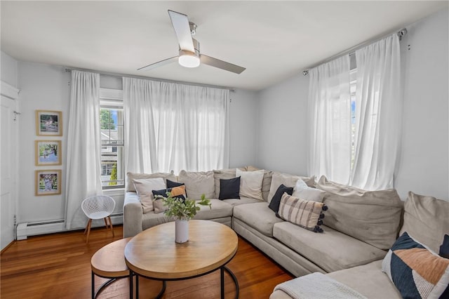 living room with ceiling fan, wood finished floors, and a baseboard radiator
