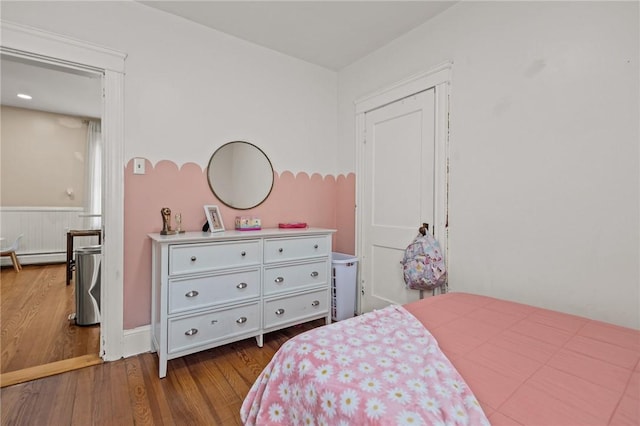 bedroom featuring dark wood-style flooring