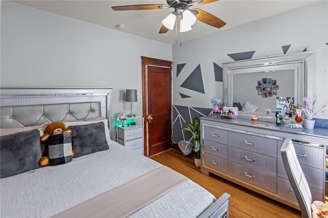 bedroom featuring wood finished floors and ceiling fan