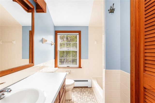 40 Wood Ave, Narragansett, RI 02882 - bathroom with baseboard heating, toilet, a tub, vanity, and tile walls