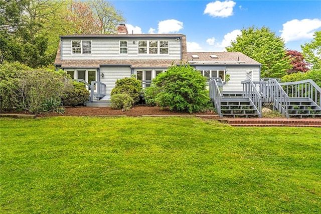 40 Wood Ave, Narragansett, RI 02882 - rear view of house with a deck, a chimney, a lawn, and stairway