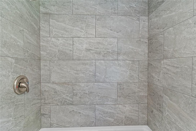 bathroom with a tile shower
